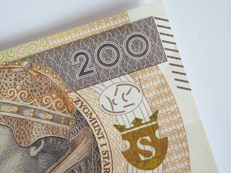 Detailed view of 200 Polish Zloty bill featuring design elements and texture.