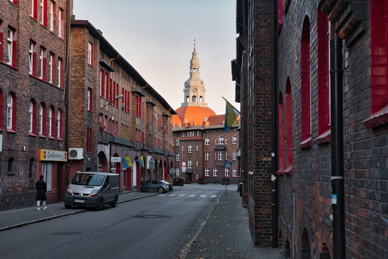 Discover the quaint charm of Katowice's historic architecture in this serene street scene.