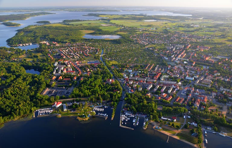 Stunning aerial view of Giżycko, Poland, showcasing urban and natural landscapes.