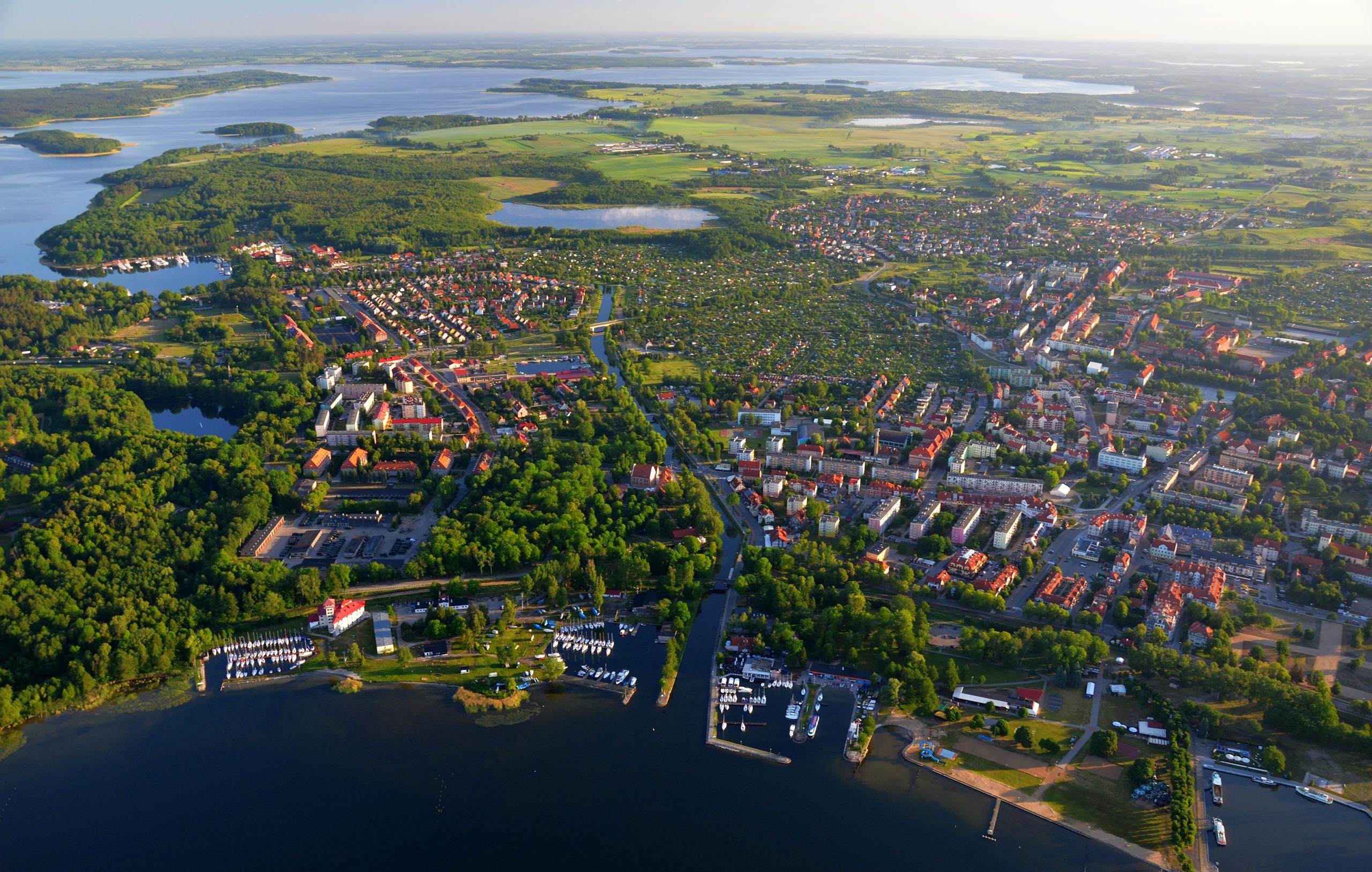 Stunning aerial view of Giżycko, Poland, showcasing urban and natural landscapes.
